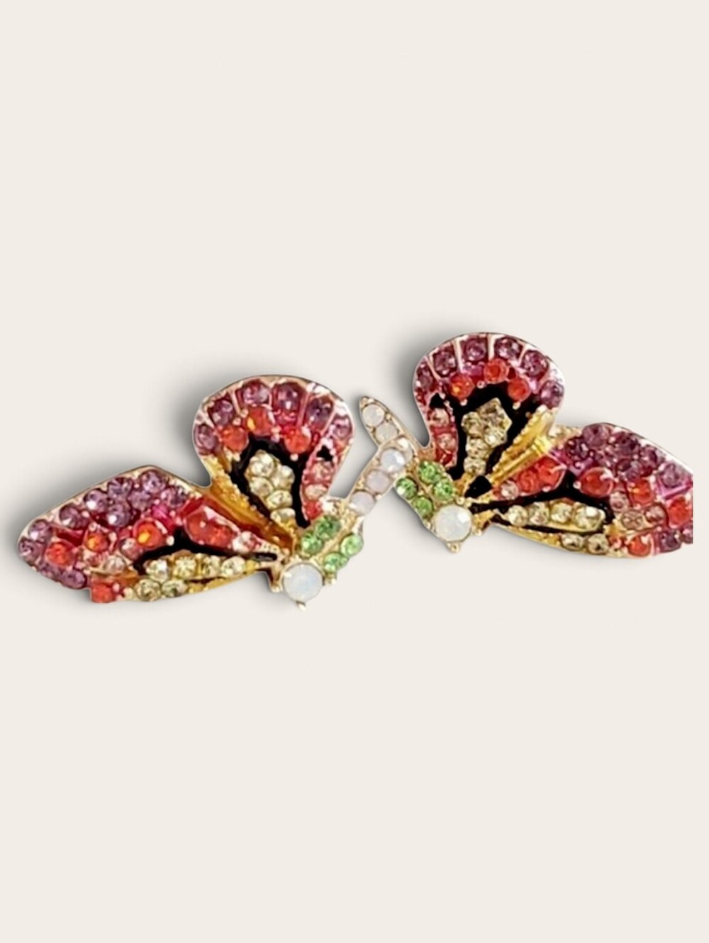 Multi-colored crystal butterfly stud earrings in pink tones; nwot